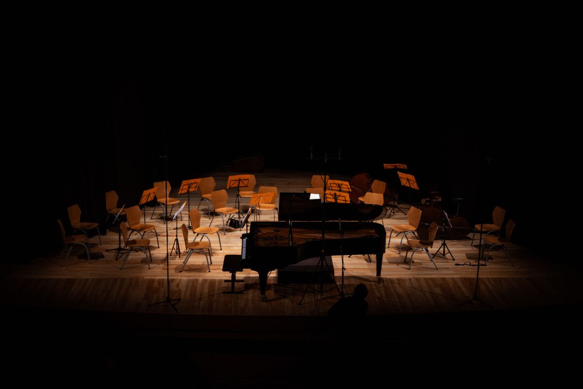 Empty concert hall stage with grand piano — Tár review